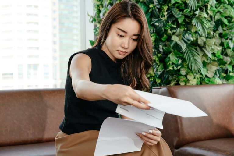 Woman Holding Paperwork